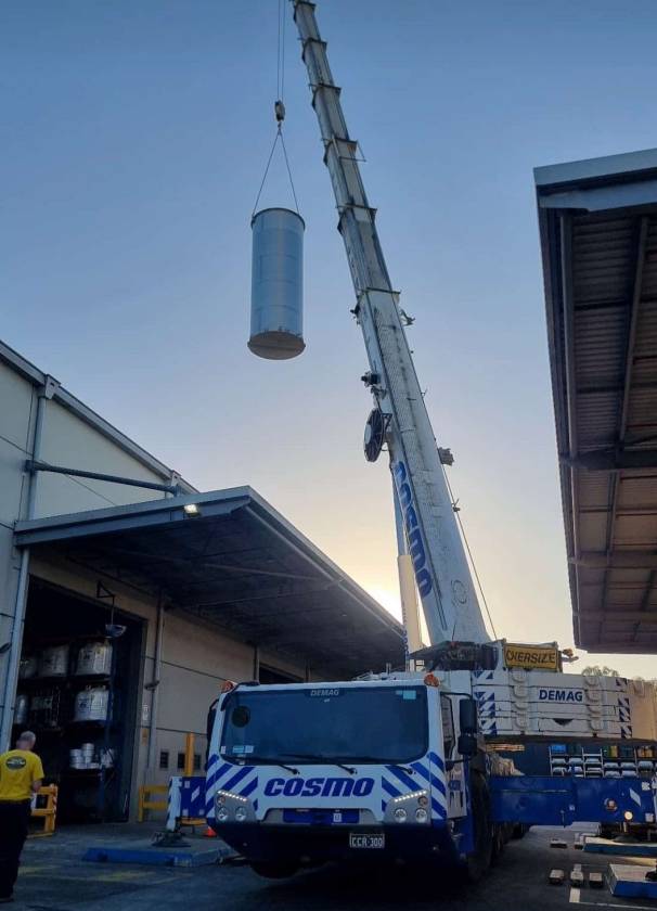 crane lowering custom ss tank